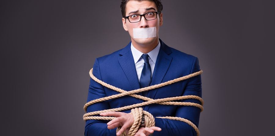 businessman taken hostage and tied up with rope